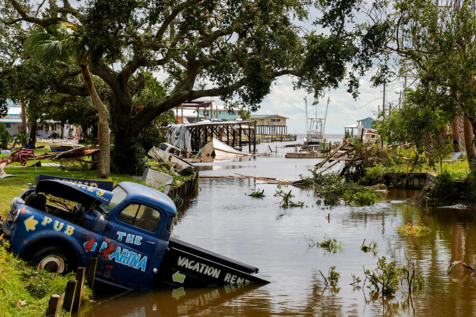 A partially submerged vehicle in a canal on Wednesday. 