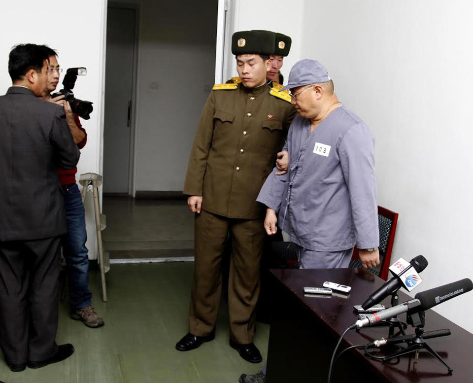 FILE - In this Jan. 20, 2014 file photo, American missionary Kenneth Bae, right, leaves after speaking to reporters at Pyongyang Friendship Hospital in Pyongyang. Bae, 45, who has been jailed in North Korea for more than a year, appealed for the U.S. to do its best to secure his release. Bae has been returned to a labor camp, prompting worries about his health, his sister Terri Chung said Friday, Feb. 7. (AP Photo/Kim Kwang Hyon, File)