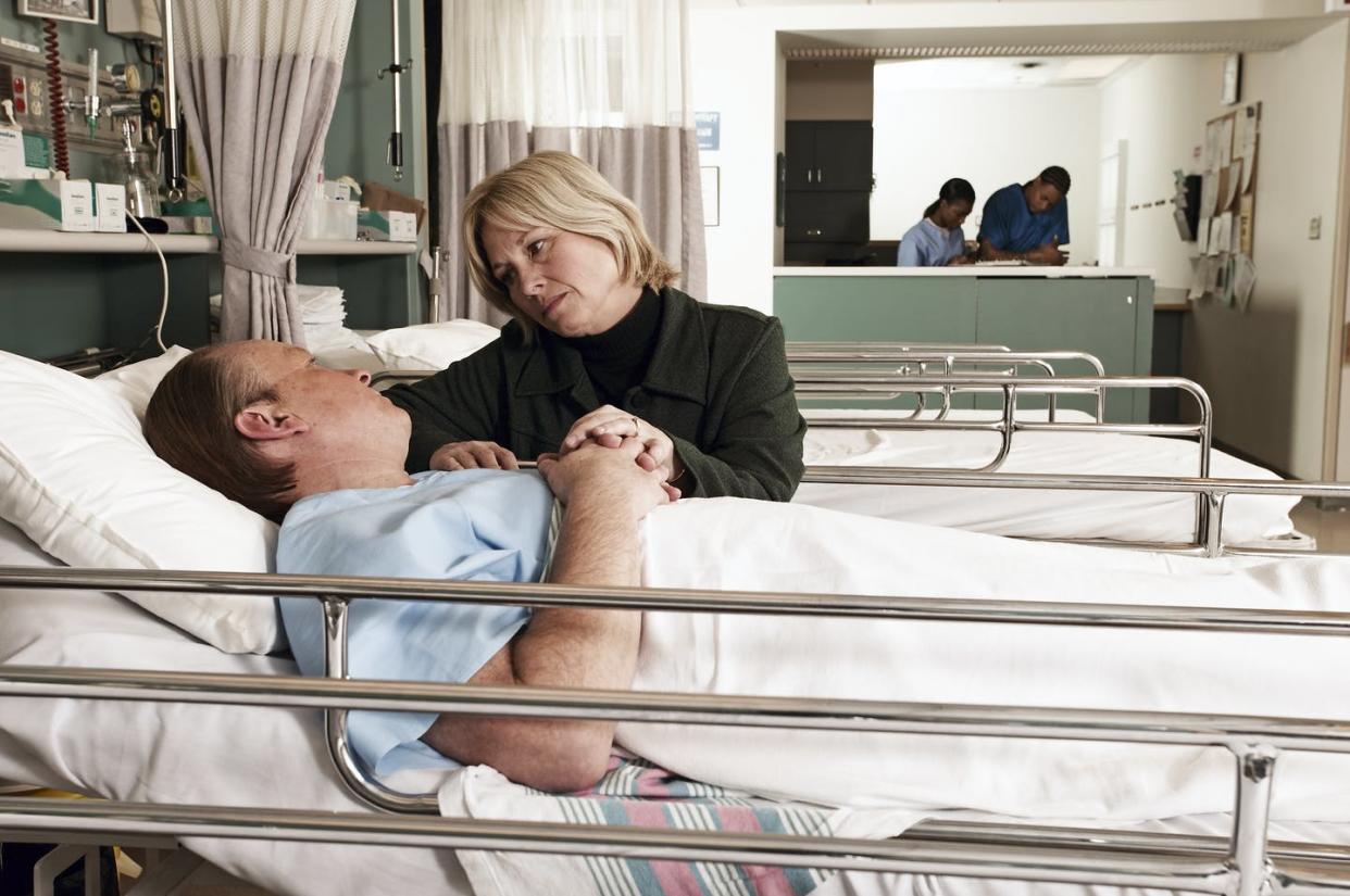 <span class="caption">Is COVID-19 hitting men harder than women?</span> <span class="attribution"><a class="link " href="https://www.gettyimages.com/detail/photo/wife-consoling-husband-in-hospital-royalty-free-image/76529620?adppopup=true" rel="nofollow noopener" target="_blank" data-ylk="slk:UpperCut Images/Getty Images;elm:context_link;itc:0;sec:content-canvas">UpperCut Images/Getty Images</a></span>