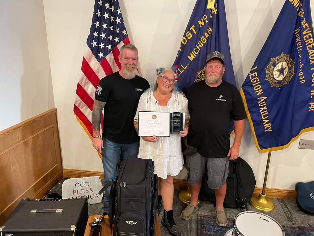 Fowlerville Junior High School Teacher Michelle Spisz, center, is named Teacher of the Year on Saturday, July 22, 2023. She is pictured with  former commander Bobby Brite and current American Legion Post 141 Commander Mark Epley.