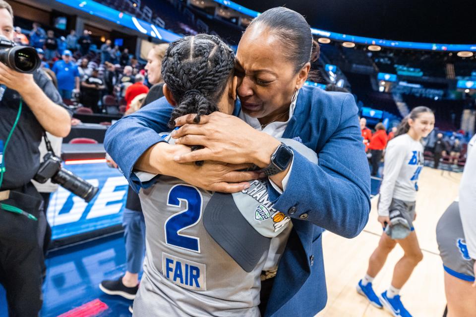 UB coach Felisha Legette-Jack hugs Dyaisha Fair after winning the MAC Tournament.