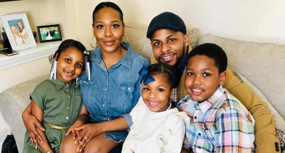 The proud parents, Rudia Napier and Michael Anthony pose with their three children. 