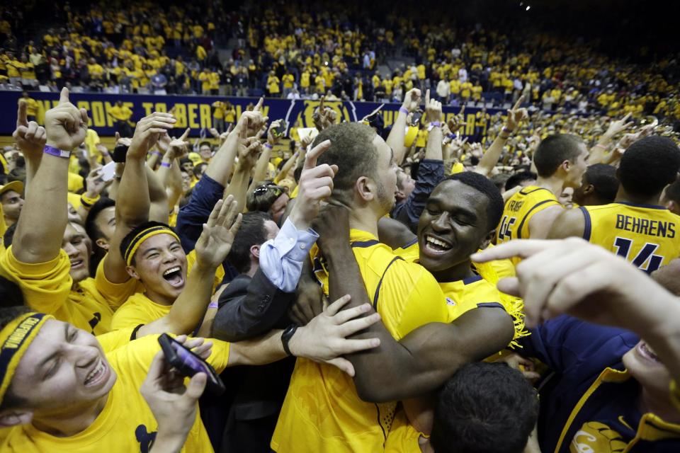 California players and fans celebrate after a win over Arizona during the second half on an NCAA college basketball game on Saturday, Feb. 1, 2014, in Berkeley, Calif. California won 60-58. (AP Photo/Marcio Jose Sanchez)