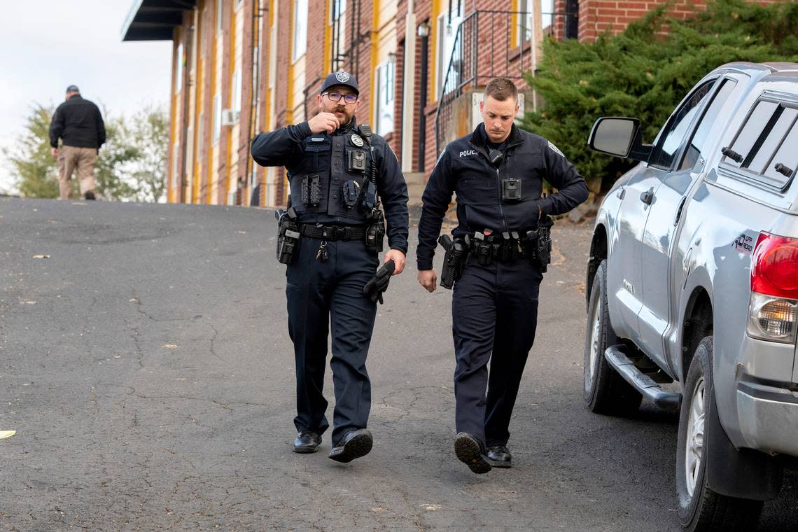 Officers patrol an apartment complex south of campus where four deceased University of Idaho students were found by local authorities on Monday, Nov. 14.