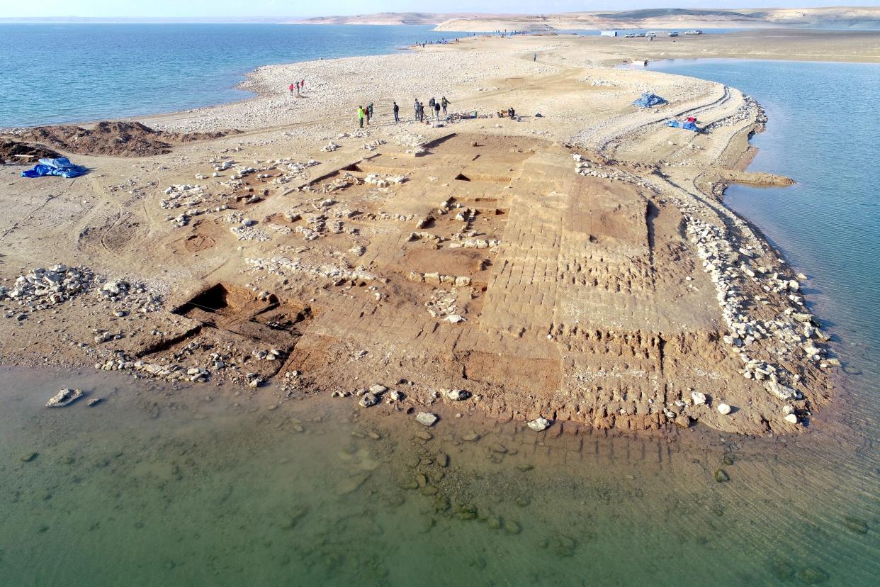 Aerial view of the excavations at Kemune with Bronze Age architecture partly submerged.