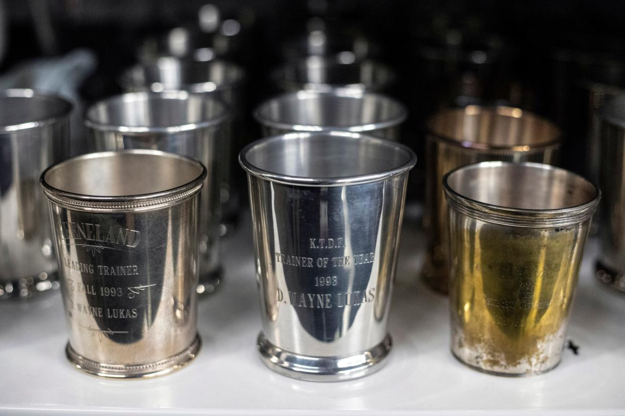 Cups commemorating past Derbys can be found neatly organized on shelves in the Kentucky Derby Museum archives. 3/26/19