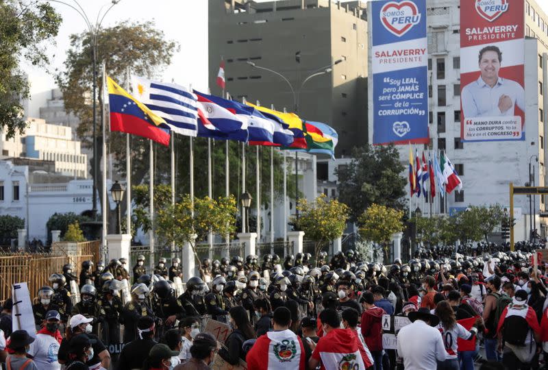 People gather outside Congress after Peru's interim President Manuel Merino announced his resignation, in Lima