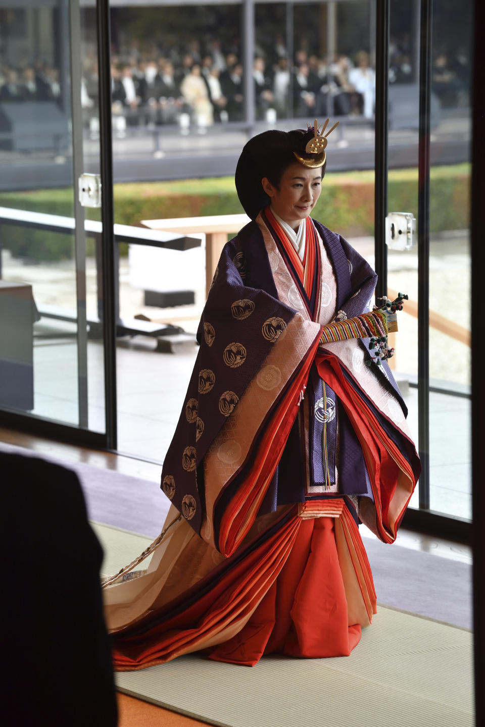 Japan's Crown Princess Kiko leaves at the end of the enthronement ceremony where Emperor Naruhito officially proclaimed his ascension to the Chrysanthemum Throne at the Imperial Palace in Tokyo, Tuesday, Oct. 22, 2019. (Kazuhiro Nogi/Pool Photo via AP)