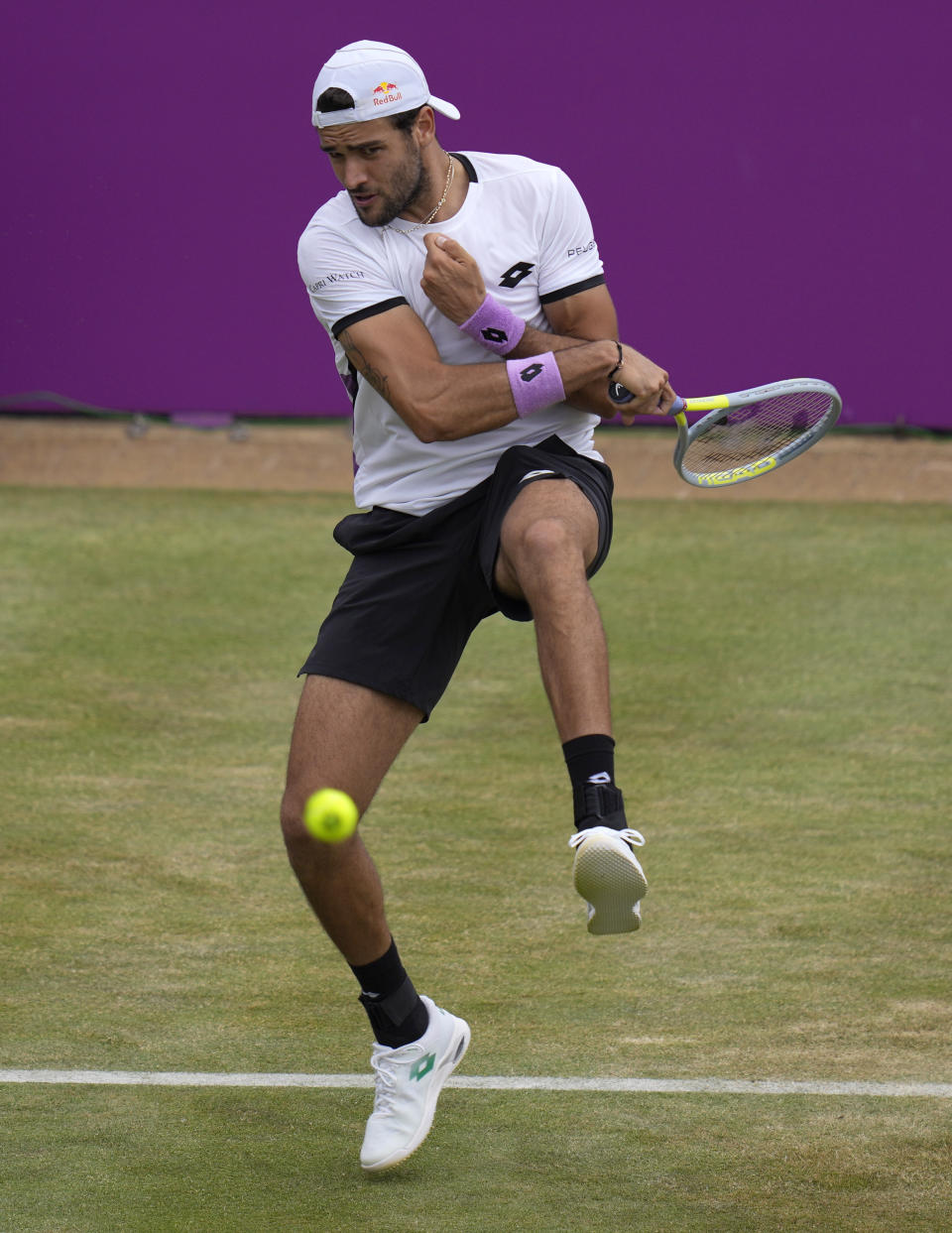 Matteo Berrettini of Italy plays a return to Andy Murray of Britain during their singles tennis match at the Queen's Club tournament in London, Thursday, June 17, 2021. (AP Photo/Kirsty Wigglesworth)