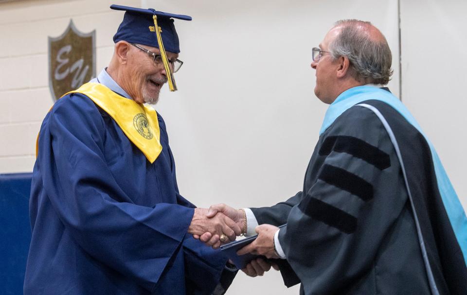 Jon Langione receives his diploma from Eastern Superintendent Joseph Mancuso Wednesday during Eastern York High School graduation.