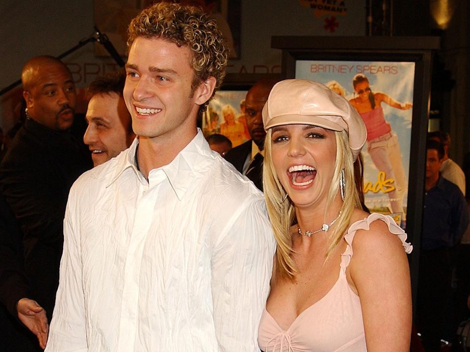 Justin Timberlake and Britney Spears smiling.