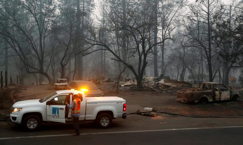 Employees of Pacific Gas & Electric work in the aftermath of the Camp fire in Paradise.
