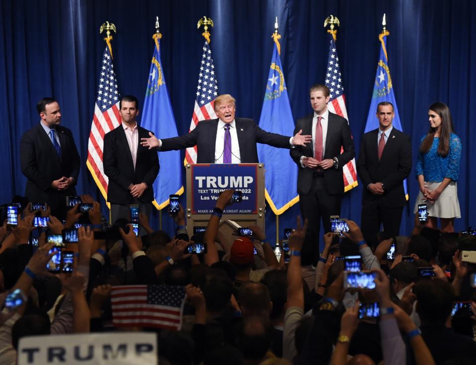 Donald Trump speaks as his sons Donald Trump Jr., second from left, and Eric Trump, third from left, look on during a caucus night watch party in Las Vegas last February. (Photo: Ethan Miller/Getty Images)