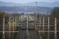 Rail tracks are pictured during a railway strike at the Saint Germain au Mont d'Or train station, around Lyon, central France, Monday, Dec. 9, 2019. French commuters inched to work Monday through exceptional traffic jams, as strikes to preserve retirement rights halted trains and subways for a fifth straight day. Citing safety risks, the SNCF national rail network issued warned travelers to stay home or use "alternate means of locomotion" to get to work Monday instead of thronging platforms in hopes of getting the few available trains. (AP Photo/Laurent Cipriani)