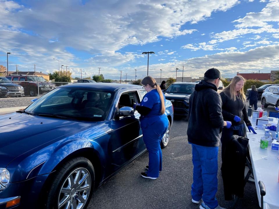 San Juan Regional Medical Center health care professionals administer flu vaccines to members of the public attending one of the hospital's drive-thru vaccine clinics in the fall of 2023.