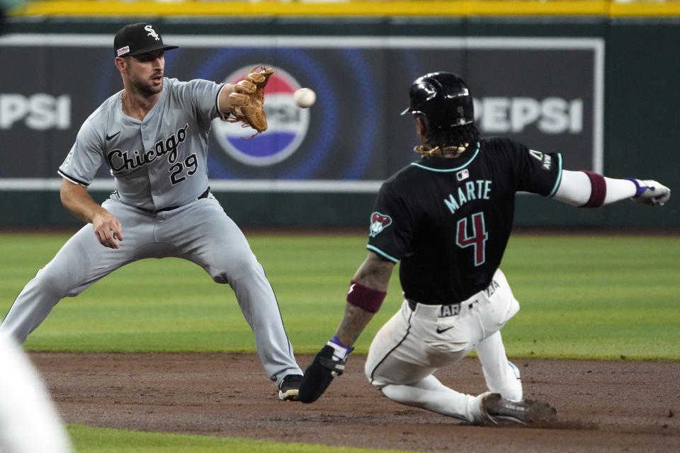 Chicago White Sox shortstop Paul DeJong gets the force out on Arizona Diamondbacks' Ketel Marte (4) on a ball hit by Joc Pederson in the first inning of a baseball game, Saturday, June 15, 2024, in Phoenix. (AP Photo/Rick Scuteri)