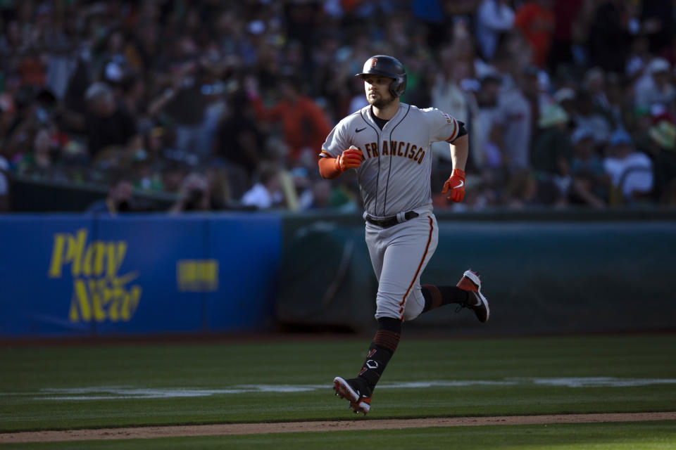 San Francisco Giants' J.D. Davis heads home with a solo home run against the Oakland Athletics during the sixth inning of a baseball game Saturday, Aug. 6, 2022, in Oakland, Calif. (AP Photo/D. Ross Cameron)