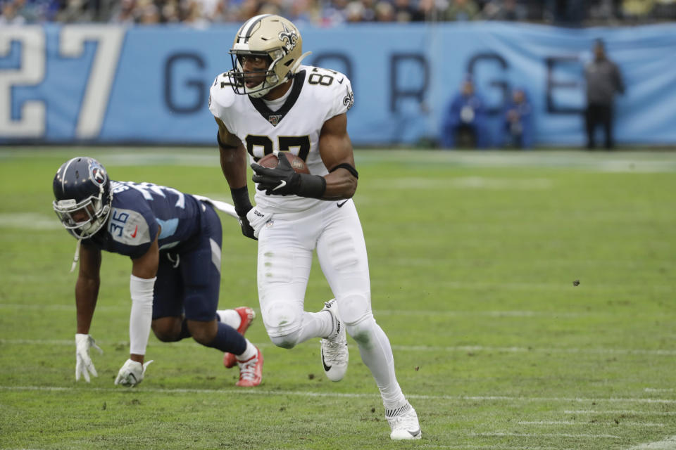 New Orleans Saints tight end Jared Cook (87) gets past Tennessee Titans cornerback LeShaun Sims (36) as Cook scores a touchdown against the New Orleans Saints in the first half of an NFL football game Sunday, Dec. 22, 2019, in Nashville, Tenn. (AP Photo/James Kenney)