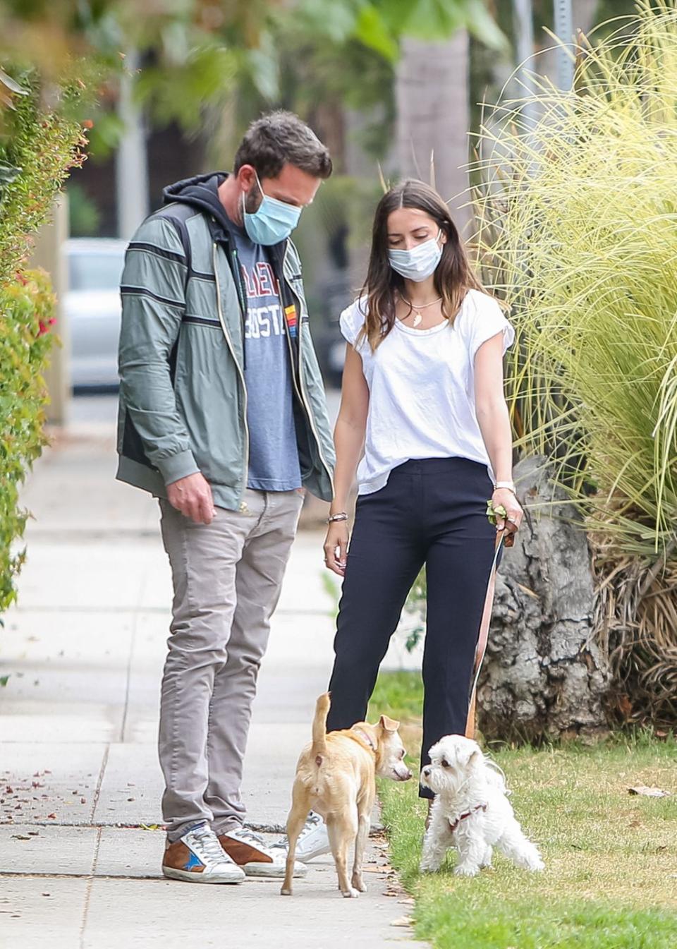 <p>No quarantine couple has thrived off PR quite like Ben Affleck’s and Ana de Armas’ relationship. The couple met on the set of their upcoming film <em>Deep Water</em>. After a getaway to Cuba in March, the pair <a href="https://www.usmagazine.com/celebrity-news/pictures/ben-affleck-and-ana-de-armas-relationship-timeline/march-13-2020/" rel="nofollow noopener" target="_blank" data-ylk="slk:started quarantining together;elm:context_link;itc:0;sec:content-canvas" class="link ">started quarantining together</a>—except they’ve been seen out together nearly once a day. The couple takes their dogs for a walk every day with Dunkin’ Donuts coffee in hand. </p><p>Ana de Armas even <a href="https://www.thecut.com/2020/04/ana-de-armas-blocks-fan-account-on-twitter.html" rel="nofollow noopener" target="_blank" data-ylk="slk:blocked a fan Twitter account;elm:context_link;itc:0;sec:content-canvas" class="link ">blocked a fan Twitter account</a> that got a little, um, creative with captions to the never-ending supply of photos. Hey, I’ll take any drama I can get.</p>