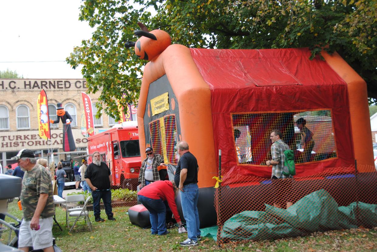 The "balloon bounce" is a popular attraction for children in the park during the annual Confluence PumpkinFest celebration.