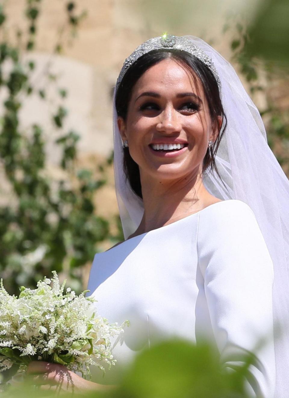 Meghan's dress featured an open bateau neck line (Getty Images)