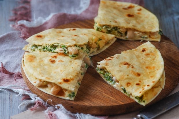 <p>This quesadilla will give you the nutrients and the energy you need to power through your day.</p><p><strong>Get the recipe: <a href="https://skinnyms.com/spinach-and-white-bean-breakfast-quesadilla-recipe/" rel="nofollow noopener" target="_blank" data-ylk="slk:Spinach and White Bean Breakfast Quesadilla;elm:context_link;itc:0;sec:content-canvas" class="link "><em>Spinach and White Bean Breakfast Quesadilla</em></a></strong></p><p>Skinny Ms</p>