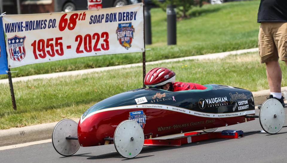 Alexis Jordan, drives a car sponsored by Vaughan Insurance, as she takes off here in this heat at the Wayne-Holmes Soap Box Derby.