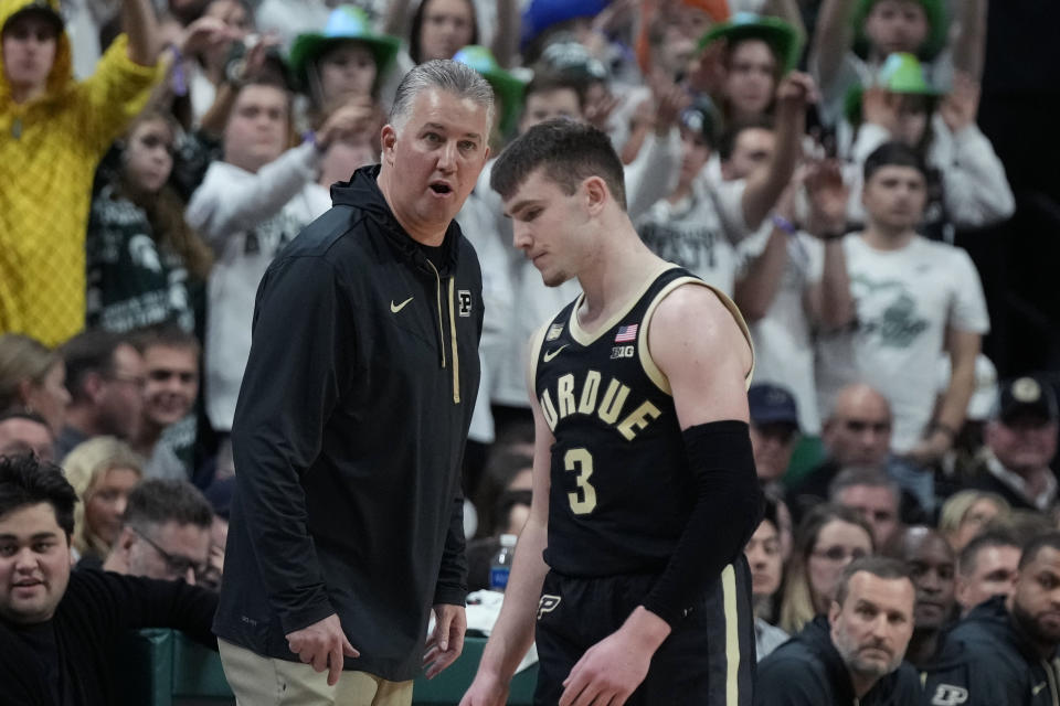 Purdue head coach Matt Painter talks to guard Braden Smith (3) during the second half of an NCAA college basketball game against Michigan State, Monday, Jan. 16, 2023, in East Lansing, Mich. (AP Photo/Carlos Osorio)