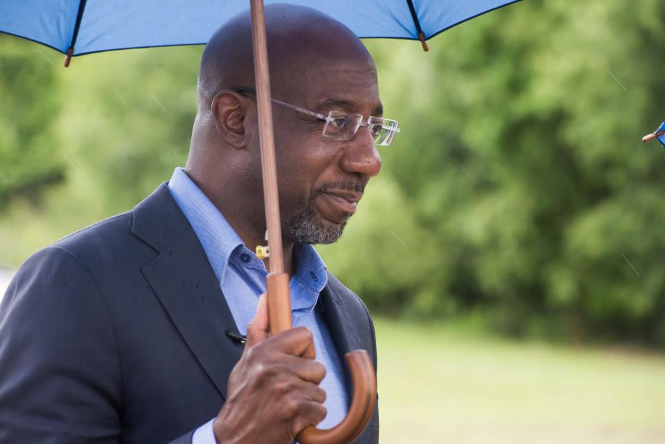 Sen. Raphael Warnock takes a tour through the Five Hives and Vines facility at Seapoint Industrial Complex during a past stop in the Savannah area.