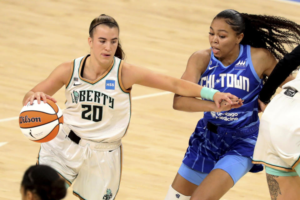 New York Liberty guard Sabrina Ionescu, left, tries to get past Chicago Sky guard Stephanie Watts, right, during a WNBA basketball game Sunday, May 23, 2021, in Chicago. (AP Photo/Eileen T. Meslar)