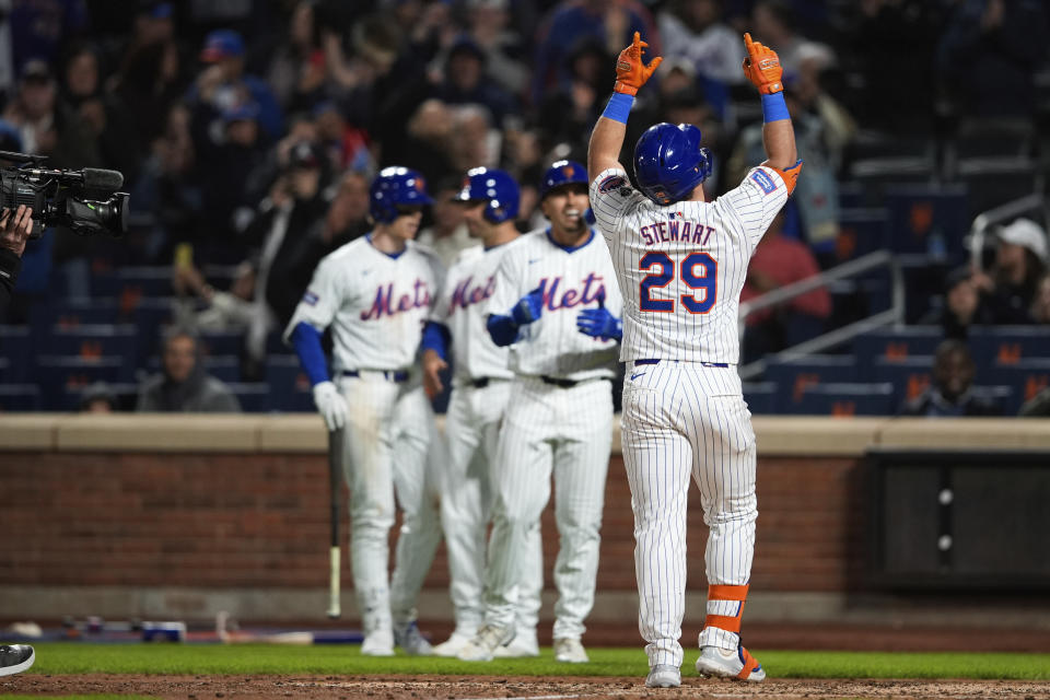 New York Mets' DJ Stewart (29) celebrates scoring after hitting a three-run home run during the sixth inning of a baseball game against the Chicago Cubs, Tuesday, April 30, 2024, in New York. (AP Photo/Julia Nikhinson)