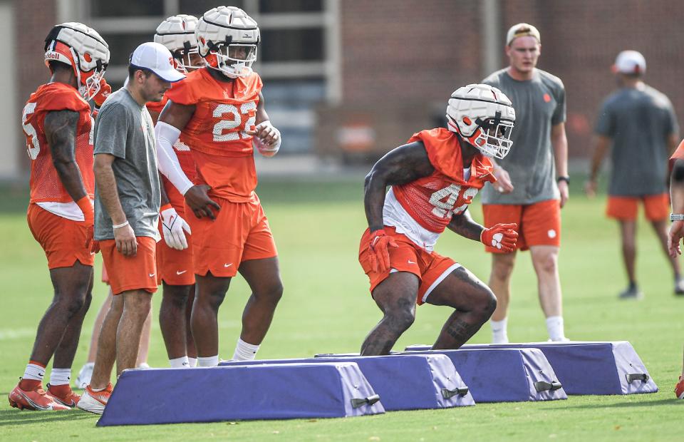 Clemson linebacker LaVonta Bentley (42) and linebacker Trenton Simpson (22) in a drill during the first day of fall football practice at the Allen Reeves Complex in Clemson Friday, August 5, 2022.