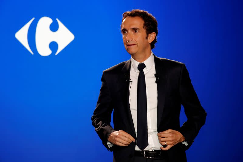 FILE PHOTO: Alexandre Bompard, CEO of French retailer Carrefour, poses before a news conference in La Defense near Paris