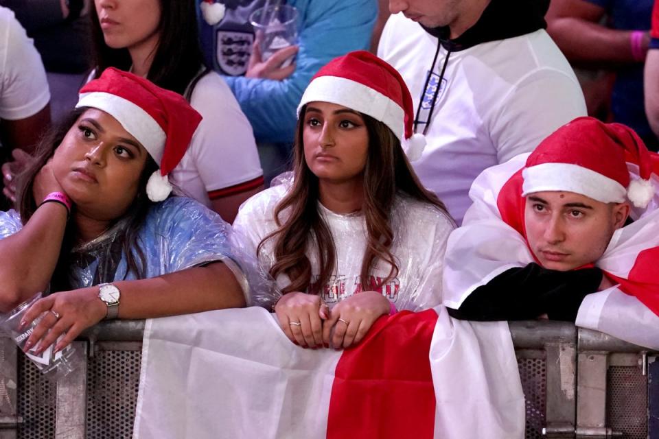 England fans at the fan park in Wembley look on in misery as England fall to France (PA)