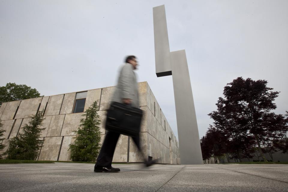 A visiter walks past "The Barnes Totem" during a preview of The Barnes Foundation Wednesday, May 16, 2012, in Philadelphia. After years of bitter court fights, the Barnes Foundation is scheduled to open its doors to the public on May 19 at its new location on Philadelphia's "museum mile." (AP Photo/Matt Rourke)