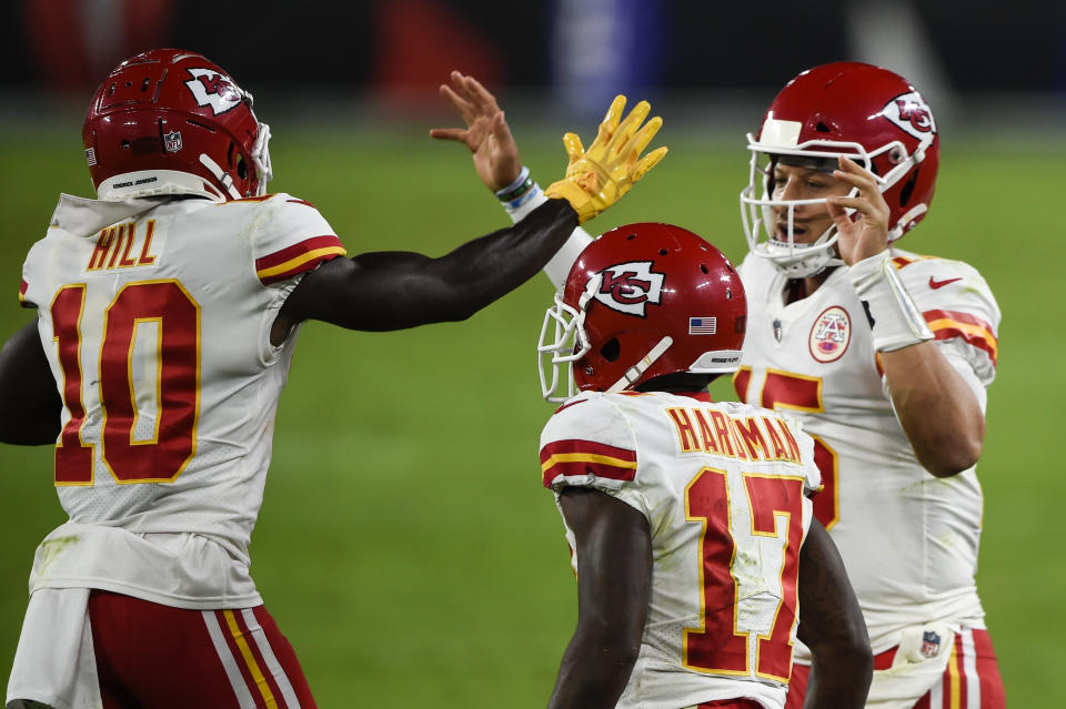 Kansas City Chiefs wide receiver Tyreek Hill (10) and quarterback Patrick Mahomes (15) celebrate after connecting for a touchdown with wide receiver Mecole Hardman (17) nearby during the first half of an NFL football game against the Baltimore Ravens, Monday, Sept. 28, 2020, in Baltimore. (AP Photo/Gail Burton)