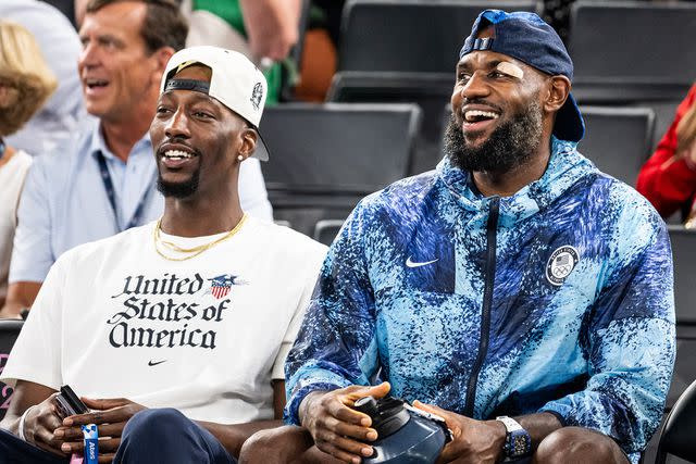 <p>Marvin Ibo Guengoer - GES Sportfoto/Getty</p> Bam Adebayo and LeBron James