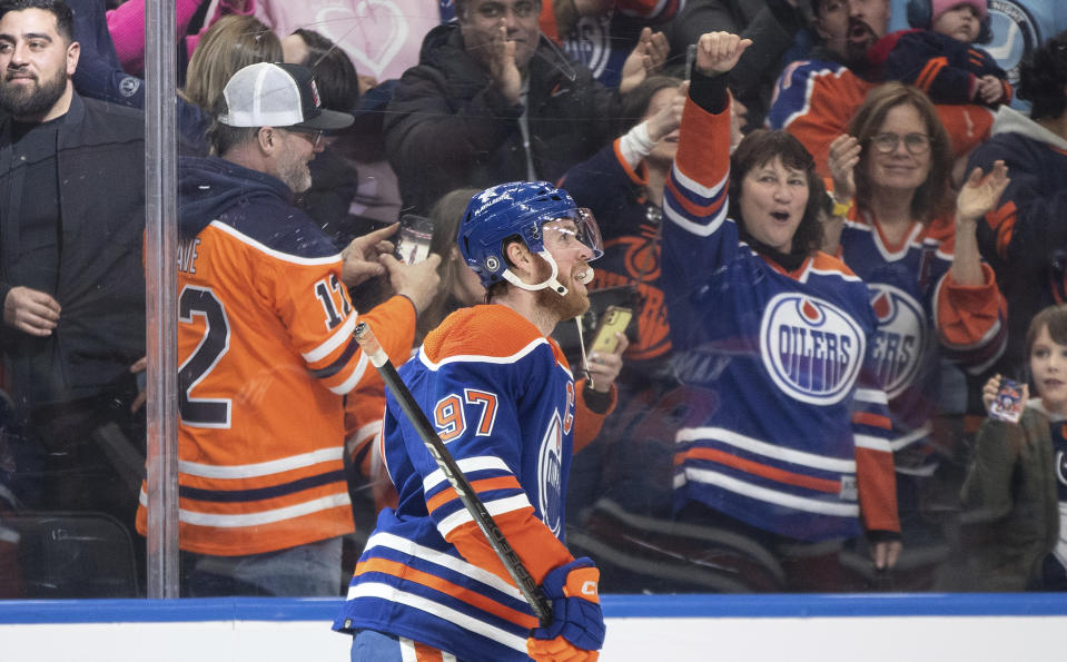 Edmonton Oilers' Connor McDavid (97) celebrates an overtime goal against the St. Louis Blues in an NHL hockey game Wednesday, Feb. 28, 2024, in Edmonton, Alberta. (Jason Branson/The Canadian Press via AP)