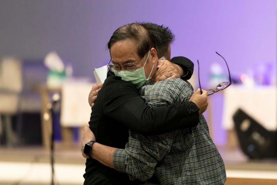 IRVINE, CALIF.: Jason Aguilar, left, a senior pastor at Arise Church, comforts Billy Chang, a 67-year-old Taiwanese pastor who survived the May 16, 2022, shooting at Geneva Presbyterian Church, during a prayer vigil in Irvine, Calif. Authorities say a Chinese-born gunman was motivated by hatred against Taiwan when he chained shut the doors of the church and hid firebombs before opening fire on a gathering of mainly of elderly Taiwanese parishioners.