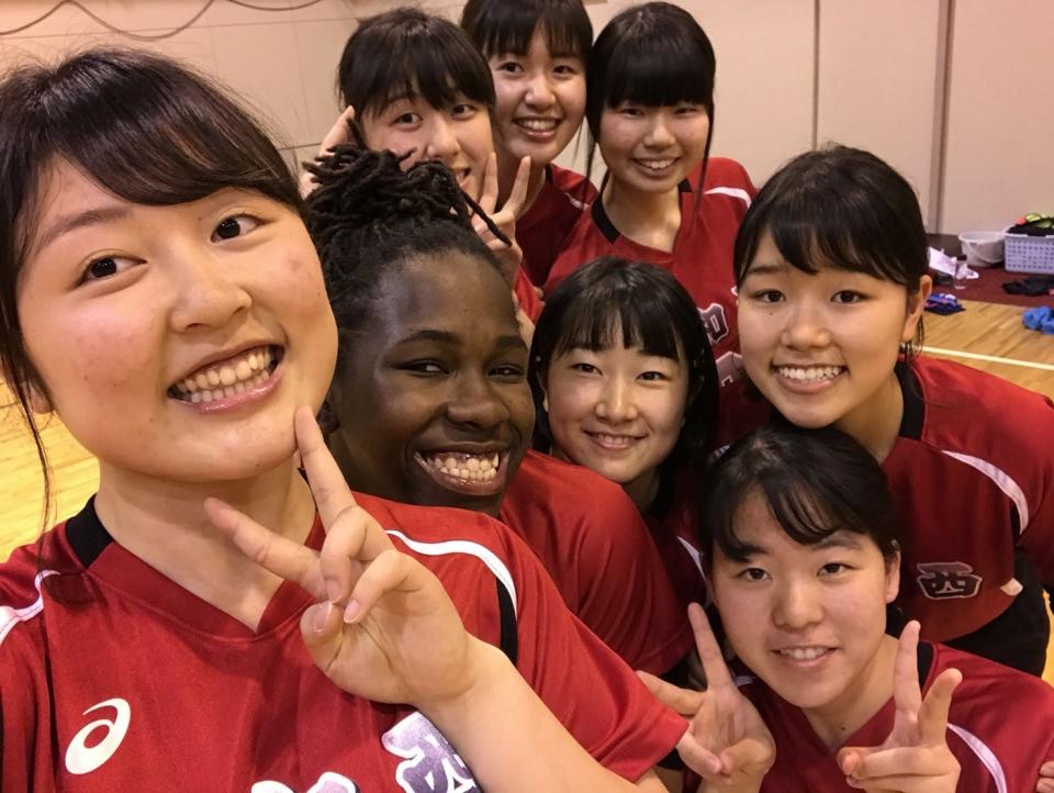 Renee Marant and her volleyball team pose for a selfie.