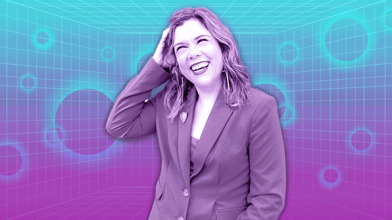 Research psychologist Dr. Rachel Kowert smiles in front of a blue and purple grid background. 