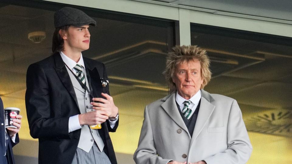 Alastair Stewart and father Rod Stewart looking concerned at a football match