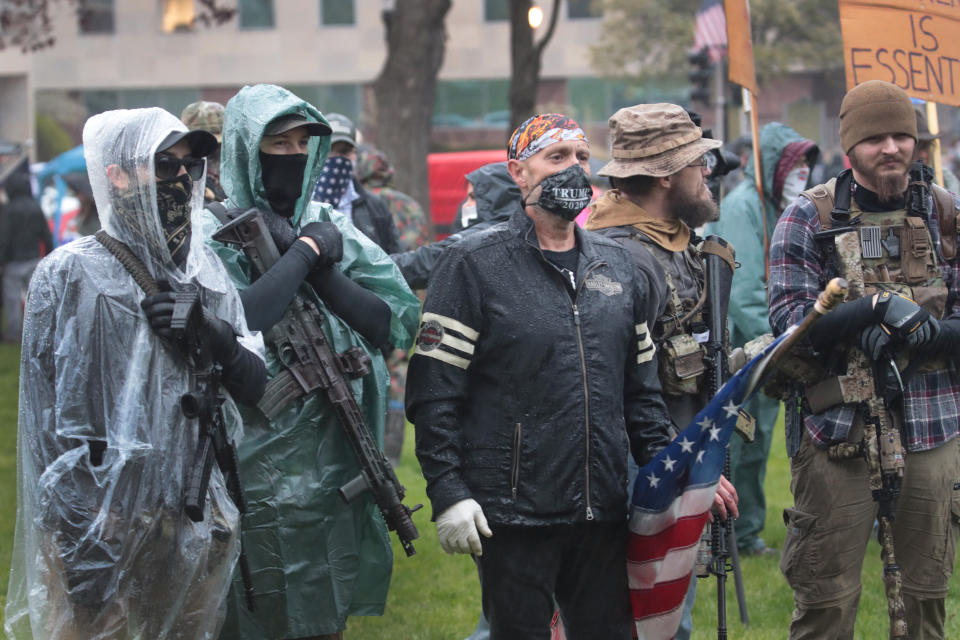 Gun-toting protesters rallied outside the Michigan state capitol this spring to demonstrate against Gov. Gretchen Whitmer's COVID-19 orders. In April, armed protesters stormed the Michigan state Capitol, and authorities later foiled a plot to kidnap Whitmer. (Photo: (Photo by Scott Olson/Getty Images))