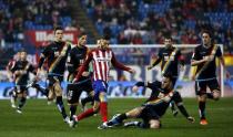 Football Soccer - Atletico Madrid v Rayo Vallecano - Spain King's Cup- Vicente Calderon stadium, Madrid, Spain - 14/1/16 Atletico Madrid's Yannick Ferreira-Carrasco and Rayo Vallecano's Joaquin Jose Marin "Quini" in action. REUTERS/Susana Vera