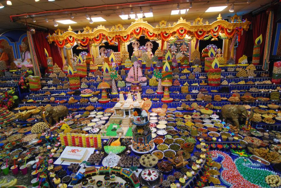 The grand Annakut celebration at the BAPS Swaminarayan Mandir (Temple) in New Castle in 2019. Annakut is part of the five day Diwali, or "Festival of Lights," which coincides with the Hindu New Year and is celebrated around the world by millions of Hindus, Sikhs and Jains.