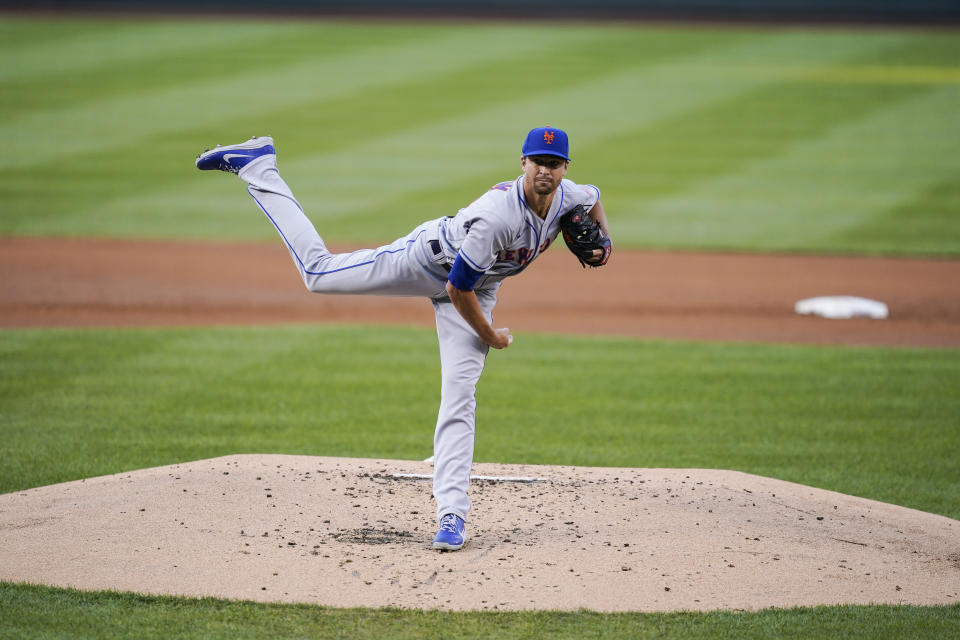 New York Mets starting pitcher Jacob deGrom follows through on his throw during the first inning of a baseball game against the Washington Nationals at Nationals Park, Tuesday, Aug. 2, 2022, in Washington. (AP Photo/Alex Brandon)