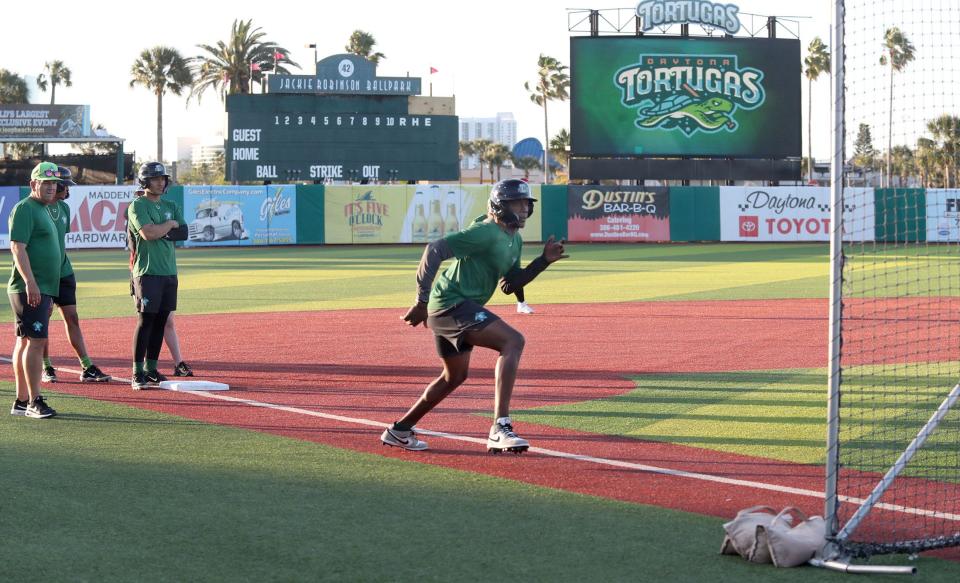 Daytona Tortugas players practice leading off third base and getting a good jump on batted balls, Thursday, April 4, 2024, at Jackie Robinson Ballpark.