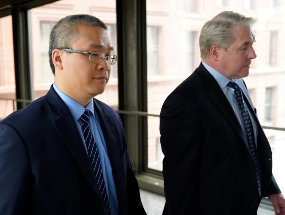 Former Minneapolis police officer Tou Thao, left, and his attorney Robert Paule arrive for sentencing for violating George Floyd’s civil rights outside the Federal Courthouse Wednesday, July 27, 2022. (David Joles/Star Tribune via AP, File)