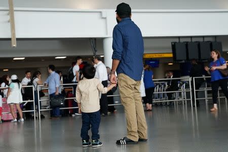 People wait for flights in advance of the incoming travel ban to the U.S. at John F. Kennedy airport in the Queens borough of New York City, New York, U.S. June 29, 2017. REUTERS/Carlo Allegri