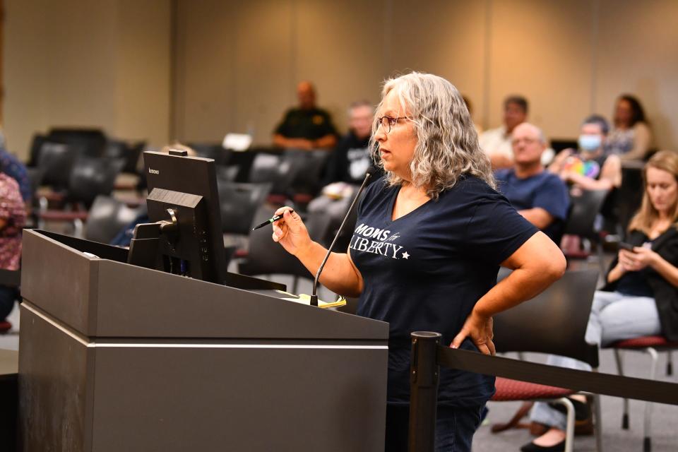 In a March 2022 photo from a Brevard school board meeting, Michelle Beavers, with Moms for Liberty suggested pulling challenged books while they are in the review process.